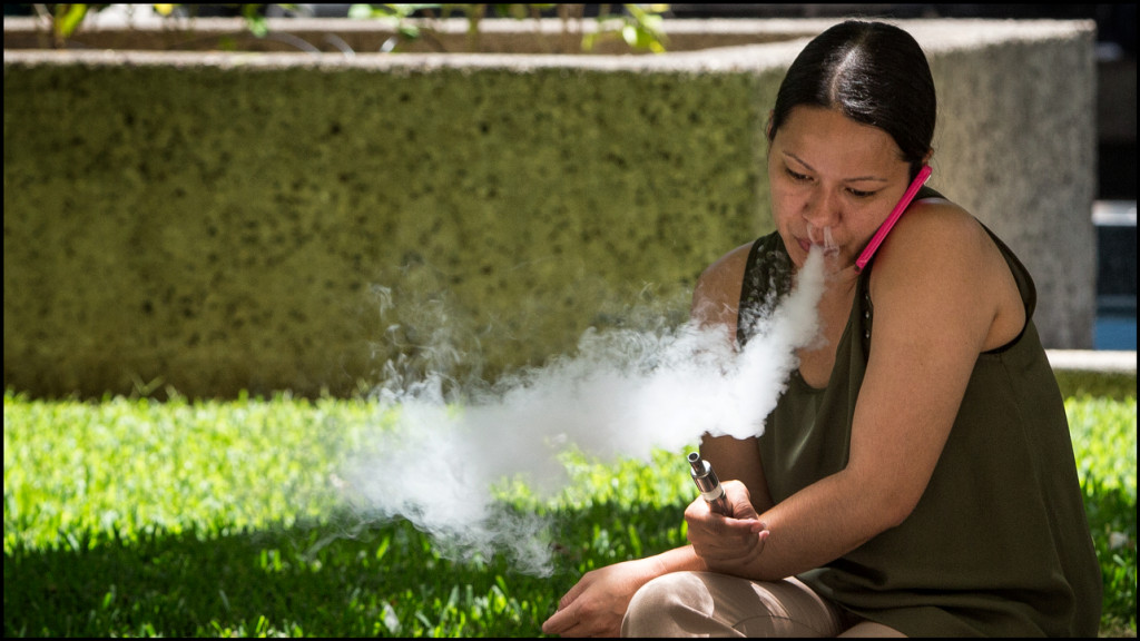 Lead Crop E-Cig smoker exhales in downtown Honolulu on July 9, 2014.