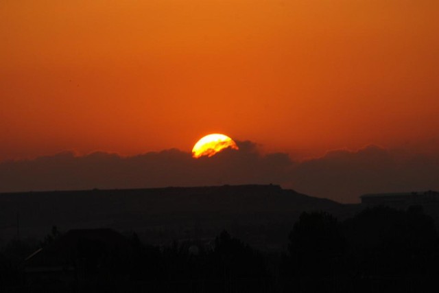 sunset into the clouds