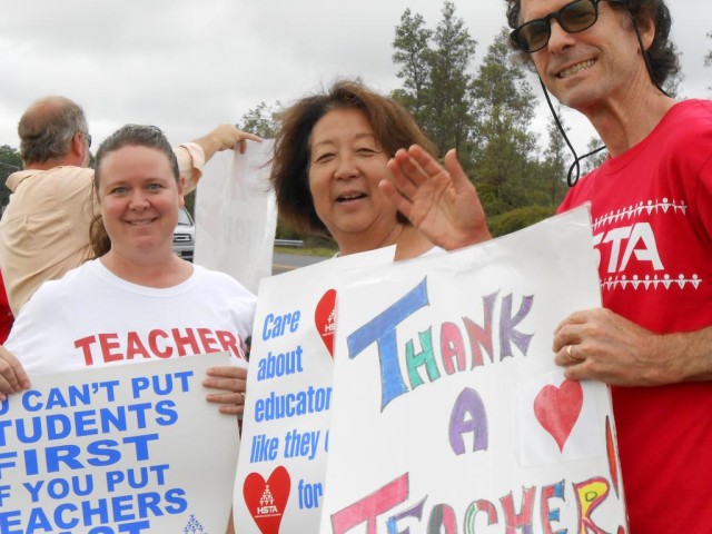 Pahoa teachers sign waving