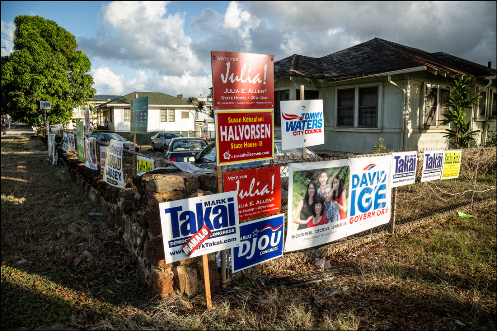 Campaign signs along wall of one house on Waialae Ave in Kaimuki on August 27, 2014