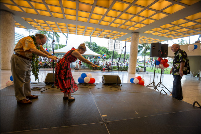 Gov. Neil Abercrombie and wife Nancie Caraway bow down to former Hawaii Gov. John Waihee after Waihee's introduction of Abercrombie to the crowd at his campaign last rally of the Primary season on August 5, 2014.