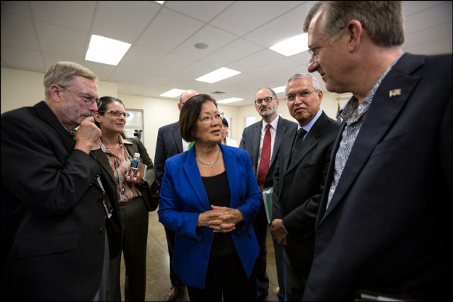 Sen. Mazie Hirono talks to group of VA staff after the end of a Senate Veteran's Affairs Committee Field Hearing at the Oahu Veterans Center on August 19, 2014.