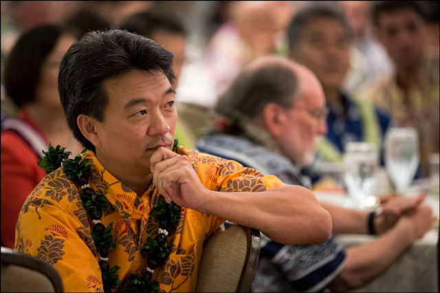 Lt. Gov. Shan Tsutsui listens to speakers with Gov. Neil Abercrombie and Sen. David Ige in the background at the Democratic Party Unity Breakfast on August 10, 2014