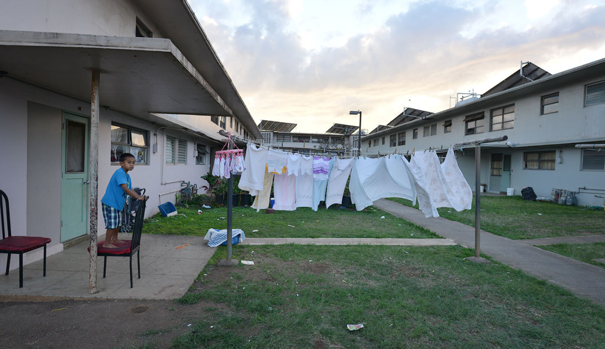 Kids play inside Mayor Wright public housing for Anita story.  Didn’t notice much neglect or damage. After speaking to several residents most declined to let me check out inside their residences.  31 jan 2015. photograph Cory Lum/Civil Beat