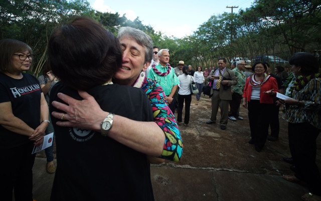U.S. Secretary of the Interior Sally Jewell hugs a volunteer before Honouliuli Monument dedication ceremony.  31 march 2015. photograph Cory Lum/Civil Beat