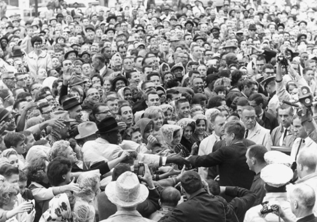 ST-525-8-63  22 November 1963  President Kennedy greets crowd at rally, Ft. Worth, Texas. Photograph by Cecil Stoughton, White House, in the John F. Kennedy Presidential Library and Museum, Boston.