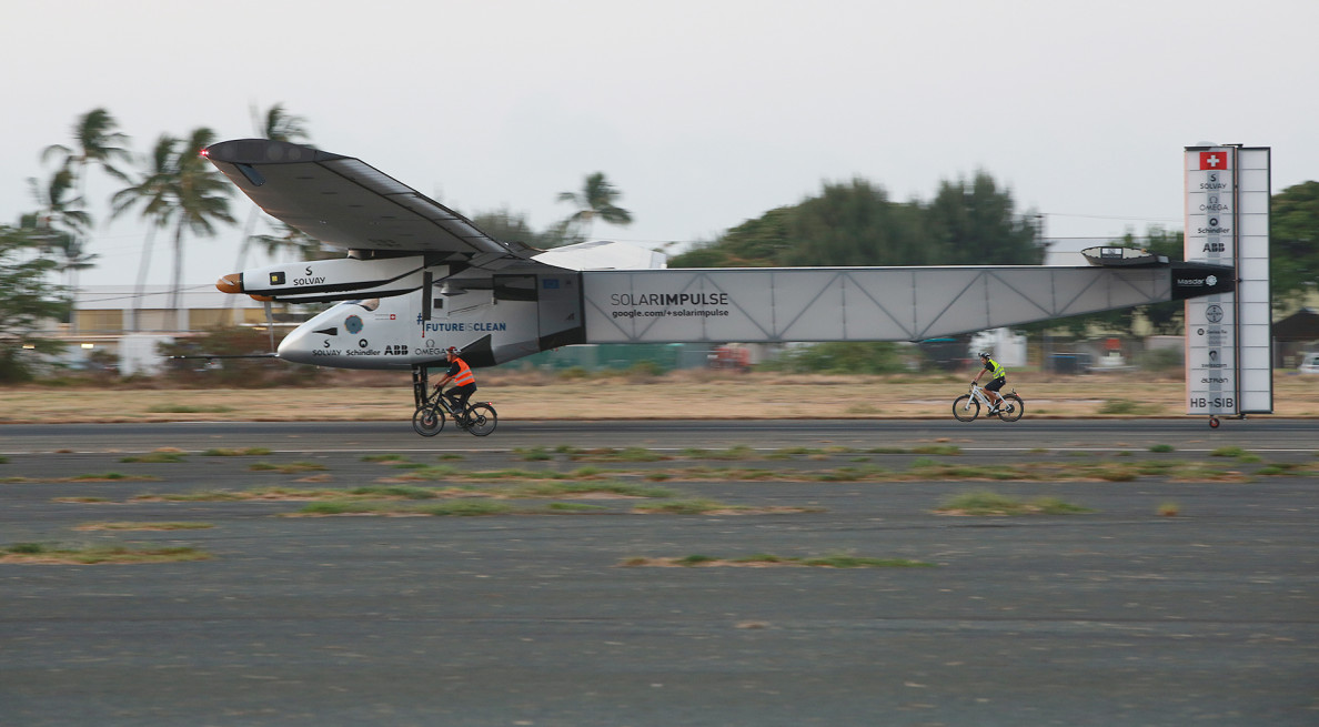 Solar Impulse 2 touches down at Kalaeloa Airport after record 5 day flight over Pacific Ocean from Nagoya, Japan.  Andre Borschberg flew Solar Impulse 2  across the Pacific as part of that team's effort at circumnavigating the globe in a solar-powered craft.  Solar Impulse 2 arrives at Kalaeloa Airport, Kapolei . Hawaii.  3 july 2015. photograph Cory Lphotograph Cory Lum/Civil Beat