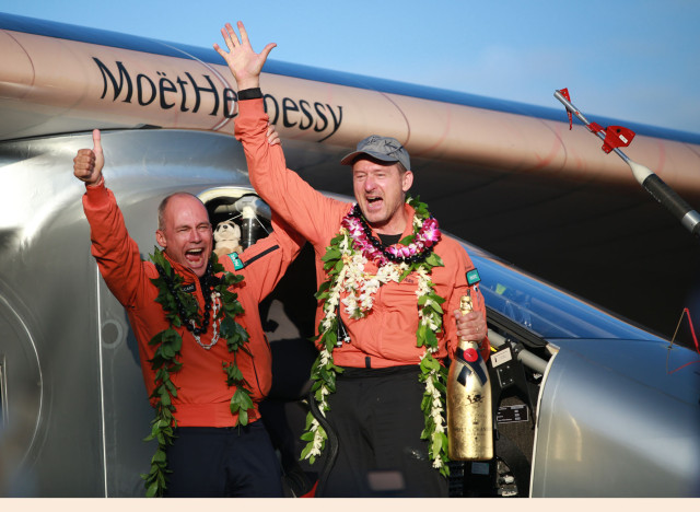 Solar Impulse 2 pilots left, Bertrand Piccard and Andre Borschberg celebrate on arrival  annd touchdown after leaving Nagoya, Japan.  Borschberg piloted the solar aircraft across the Pacific as part of that team's effort at circumnavigating the globe in a solar-powered craft.  Solar Impulse 2 arrives at Kalaeloa Airport, Kapolei . Hawaii.  3 july 2015. photograph Cory Lum