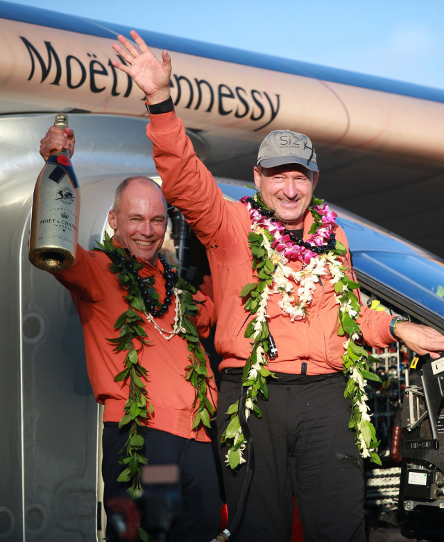 Solar Impulse 2 pilots left, Bertrand Piccard and Andre Borschberg celebrate on arrival annd touchdown after leaving Nagoya, Japan. Borschberg piloted the solar aircraft across the Pacific as part of that team's effort at circumnavigating the globe in a solar-powered craft. Solar Impulse 2 arrives at Kalaeloa Airport, Kapolei . Hawaii. 3 july 2015. photograph Cory Lum