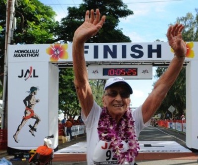 Gladys Burrill crosses a finish line.