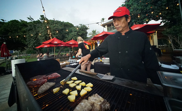 Barefoot Cafe Griller Glenn Sakiguchi grills some steaks and fish with propane grill. 5 dec 2015. photograph Cory Lum/Civil Beat