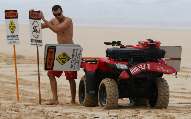 Safety experts say don't swim at beaches where there is no lifeguard. But beefing up the lifeguard system is expensive.