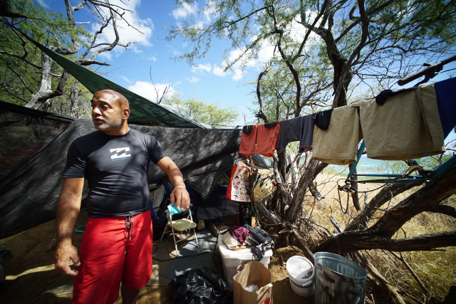Allan Tang lives in a tent with Kelley along Diamond Head slopes. Denby Story.