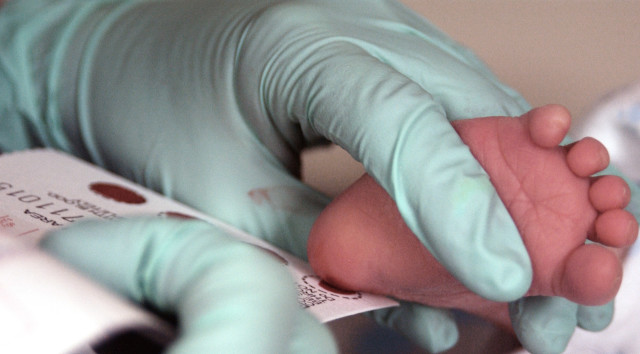 The blood of a two week-old infant is collected for a Phenylketonuria, or PKU, screening Dec. 12 at Eielson Air Force Base, Alaska. PJU is a recessive genetic disorder that can cause problems with brain development, which could lead to mental retardation and seizures. All infants born at Eielson are screened for PKU at their two week well baby check up appointment. (U.S Air Force photo/Staff Sgt Eric T. Sheler)