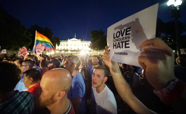 Scores of demonstrators gather at the Whitehouse to denounce the Orlando killings during candlight vigil held in Washington DC. 12 june 2016