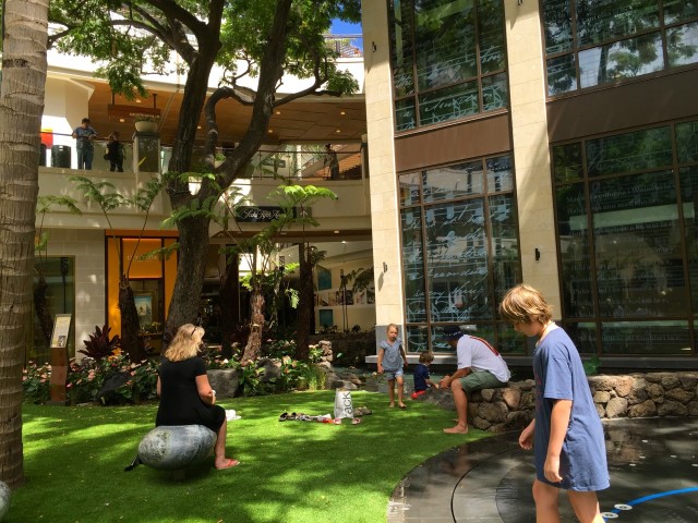 Queen's Court at the market place uses artificial turn instead of grass. Some visitors said they liked that better because their kids wouldn't get dirty.. 