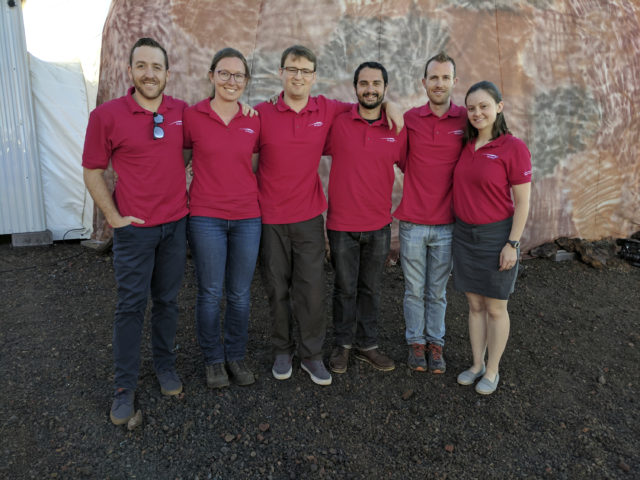 This Jan. 19, 2017, photo released by the University of Hawaii shows the university’s Hawaii Space Exploration Analog and Simulation (HI-SEAS) crew members, from left, Joshua Ehrlich, Mission Specialist, Biology, Laura Lark, Mission Specialist, Information Technology and Outreach, Samuel Payler, Science Officer, Brian Ramos, Health and Performance Officer, James Bevington, Commander, and Ansley Barnard, Engineering Officer outside the HI-SEAS facility at the Mauna Loa volcano, Big Island, Hawaii. After eight months of living in isolation on a remote Hawaii volcano, six NASA-backed space psychology research subjects will emerge from their Mars-like habitat on Sunday, Sept. 17, 2017. The participants are in a study designed to better understand the psychological impacts of a long-term manned mission to space on astronauts. (University of Hawaii via AP)
