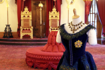 This Friday, Jan. 26, 2018 photo shows the throne room of Iolani Palace in Honolulu. Furor erupted in the 1990s after Native Hawaiian heiress, Abigail Kawananakoa, sat on one of the thrones for a Life magazine photo shoot and damaged some of its fragile threads, though repairs were made, and the throne was returned to the throne room. The uproar led to her ouster as president of Friends of Iolani Palace, a position she held for more than 25 years. (AP Photo/Caleb Jones)