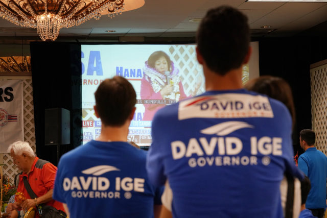 Governor Ige supporters watch Gubernatorial candidate Colleen Hanabusa speak to supporters on television. 11 aug 2018